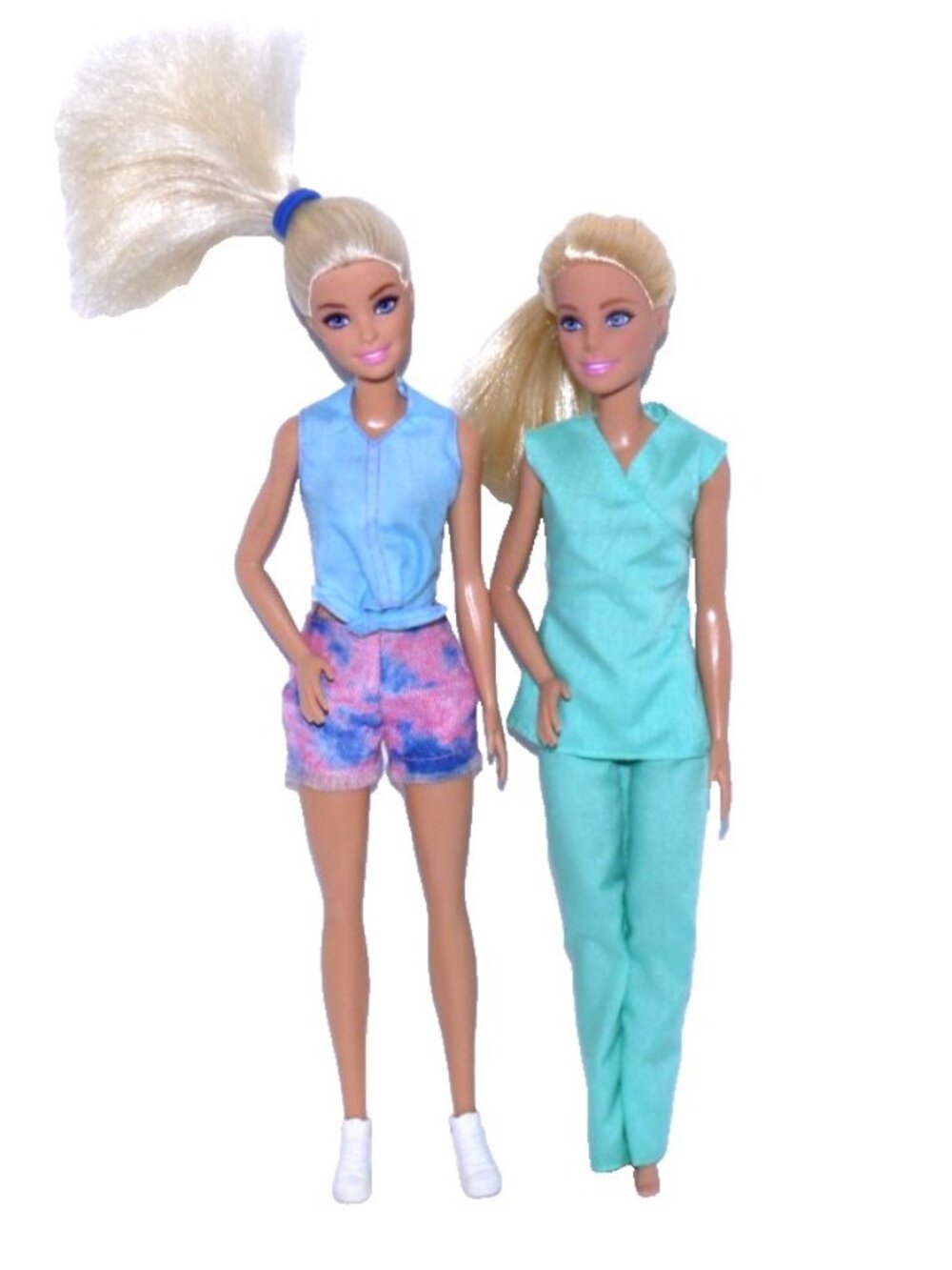 Barbie set of two dolls clothes do not match dolls  As Is